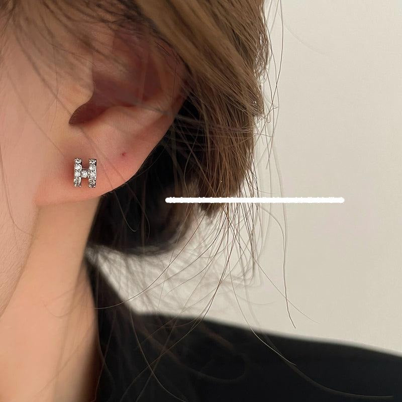 Zircon H Stud Earrings