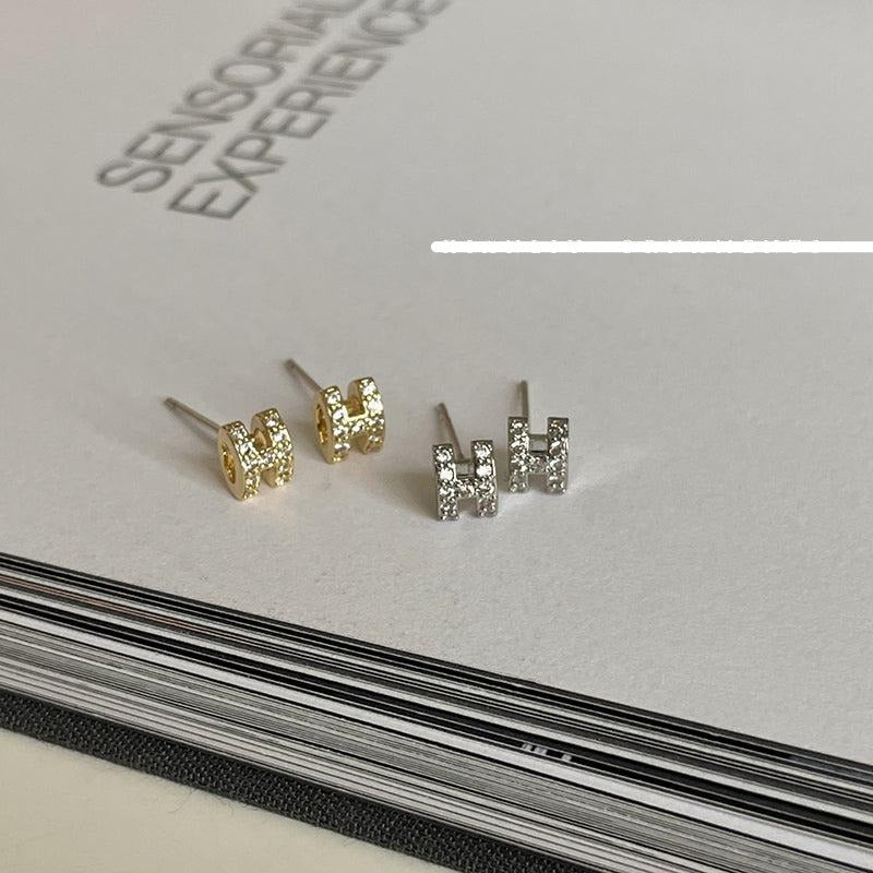 Zircon H Stud Earrings