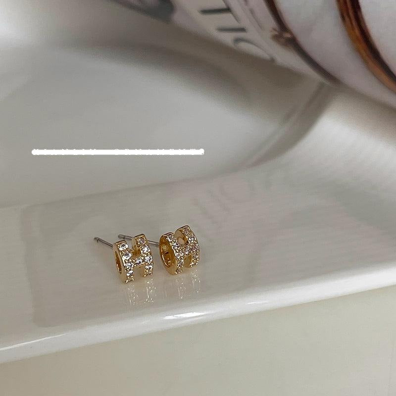 Zircon H Stud Earrings