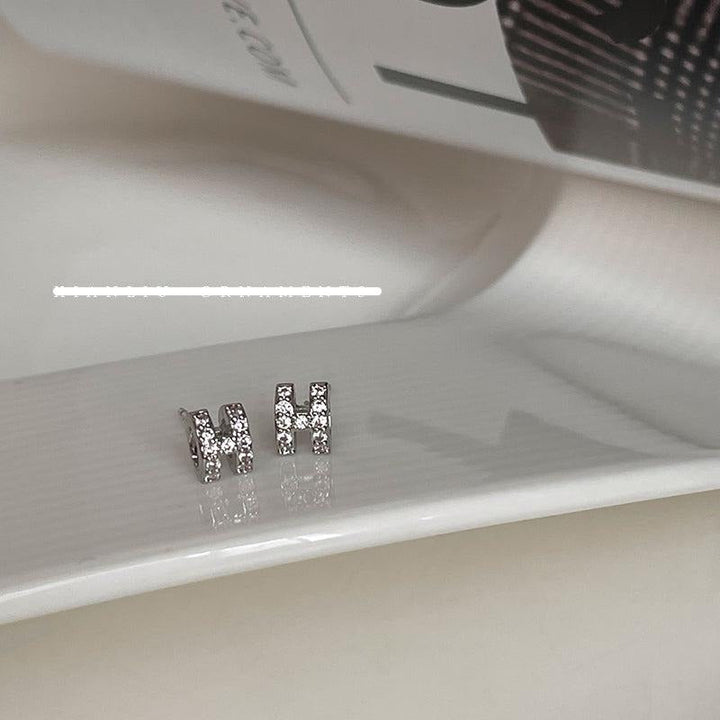 Zircon H Stud Earrings